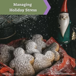 A basket of gingerbread person-shaped cookies covered in powdered sugar sits in front of a gnome figurine with a red hat to signify holiday celebrations. 