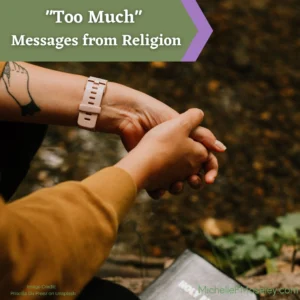 Two hands are clasped together and below them is the ground where you see some leaves and the corner of a Bible.  There is a tatto with the outline of a hand on the left forearm.  