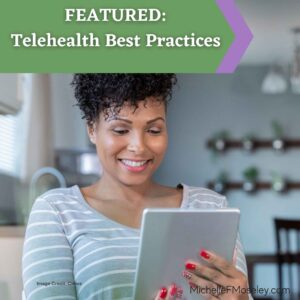 A woman with light brown skin and red fingernails holds an electronic tablet as she meets with her healthcare provider via telehealth.  