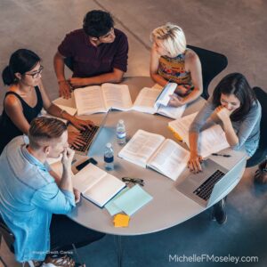 A group of people around a table learning more about mental health