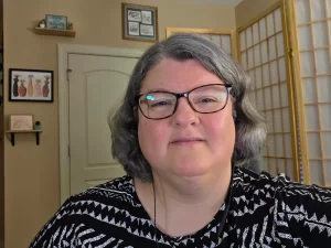 An image of Michelle F. Moseley in her office preparing for a telehealth mental health therapy session.