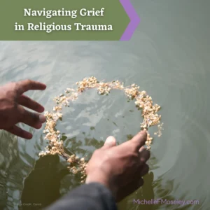 Two hands reach toward a circle of flowers resting atop water, symbolizing the grief of letting something go.
